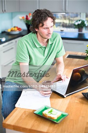 Mid adult man working from home