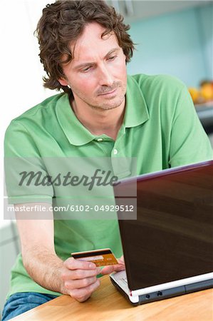 Mid-adult man  online shopping