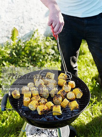 Man grilling corn