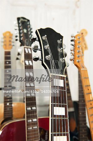 Close up of various guitars