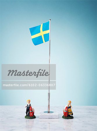 Studio shot of swedish flag and small figurines