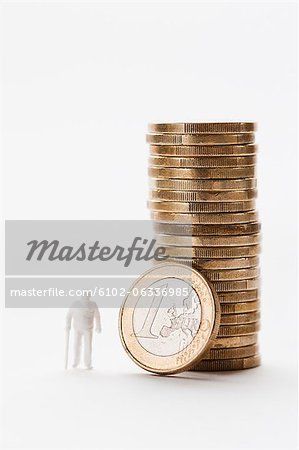Stack of coins with figurine