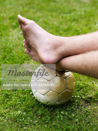 Bare foot on soccer ball