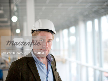 Portrait of smiling architect on building site