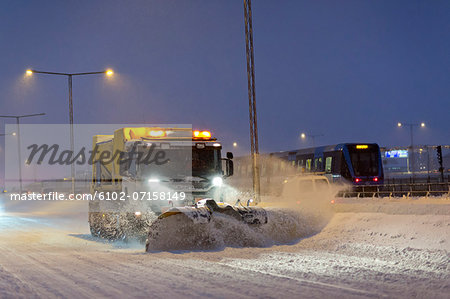 Snow plough at dusk