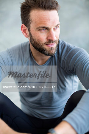 Mid adult man wearing sport clothes, studio shot