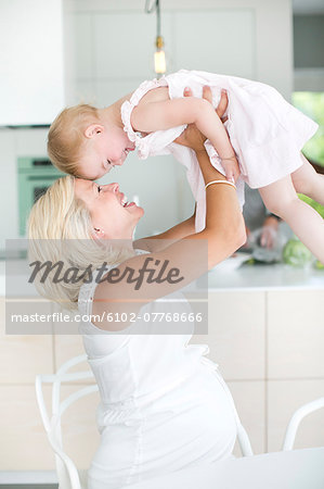 Pregnant woman playing with daughter, Stockholm, Sweden