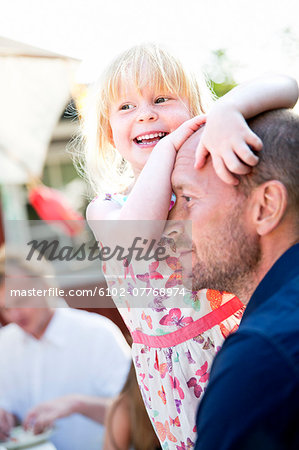 Smiling girl with father, Sweden