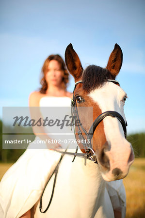 Woman ridding on horse