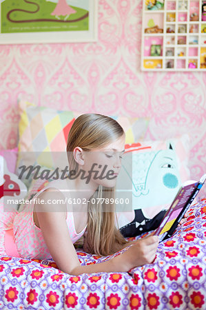 Girl reading in her room