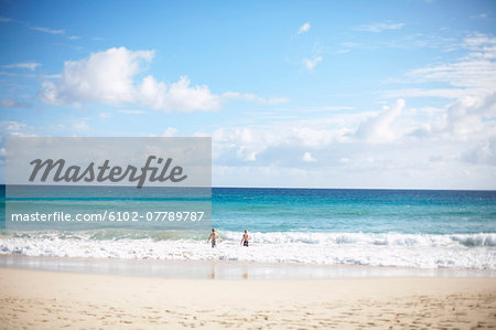 Boys bathing in sea