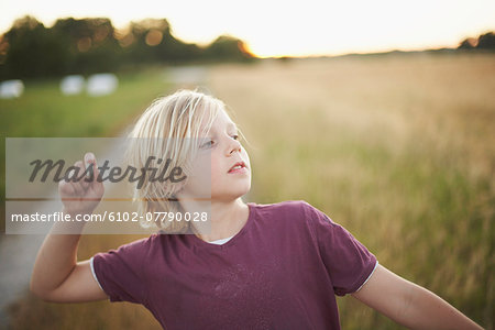 Boy throwing stone