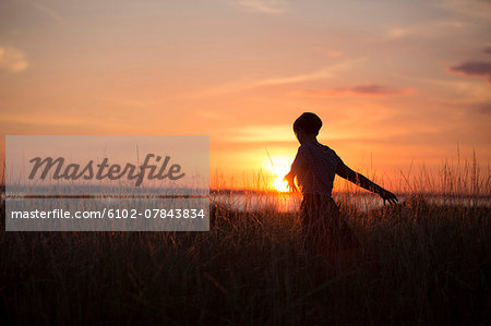 Silhouette of woman at sunset