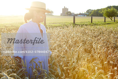 Mature woman standing on wheat field