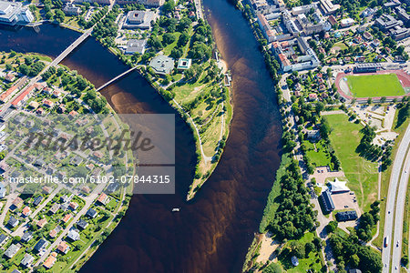 Aerial view of river flowing through city