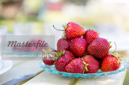 Close-up of strawberries on crystal plate