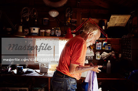 Senior man in workshop
