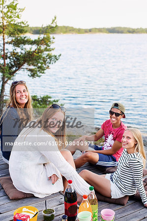 Smiling teenagers at water