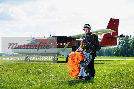 Sky-diver on airport after safe landing