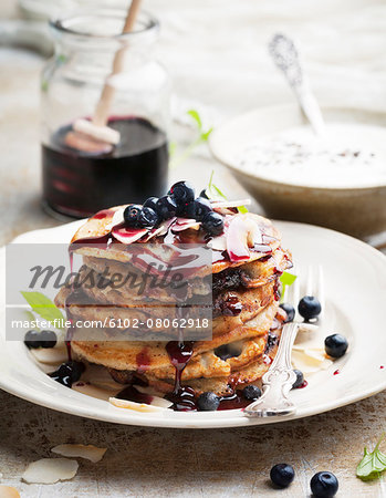 Pancakes with sauce and blueberries
