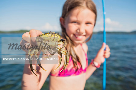 Girl holding crab
