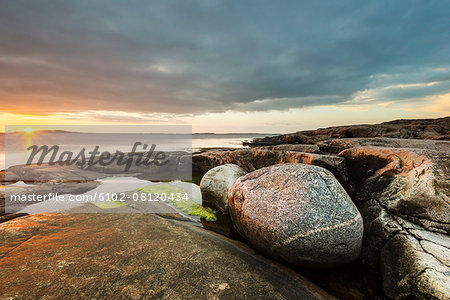 Sunset at rocky beach