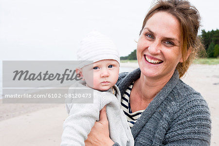 Smiling mother with baby boy
