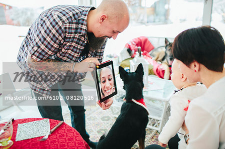 Family talking via digital tablet