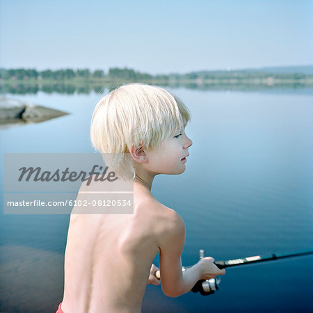 Boy fishing - Stock Photo - Masterfile - Premium Royalty-Free, Code:  6102-08120534
