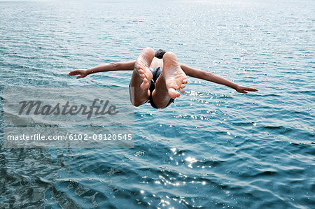 Man jumping into sea