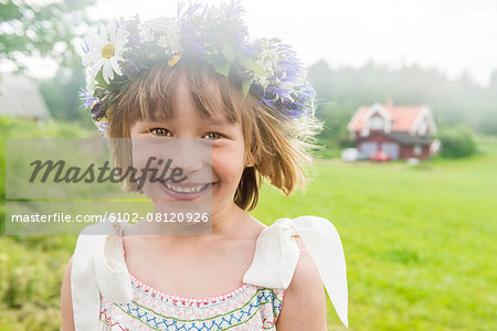 Portrait of girl wearing flower wreath