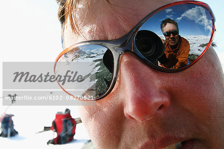 Photographer reflecting in sunglasses