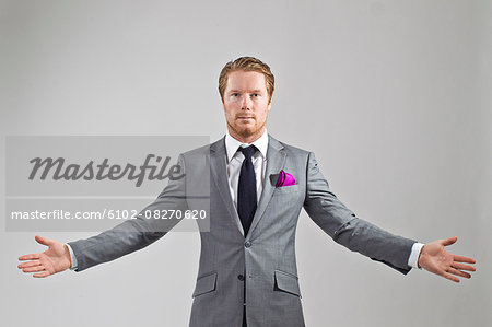 Portrait of man wearing suit, studio shot