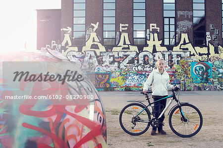 Teenage girl with bicycle
