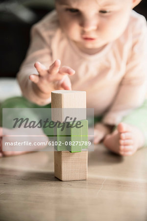 Wooden blocks, baby on background