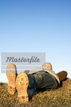 Woman relaxing on meadow