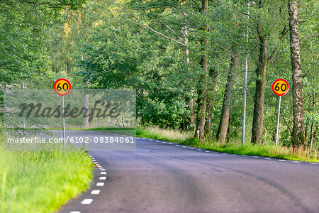 Country road with speed limit sign