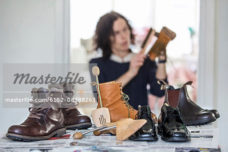 Woman polishing shoes