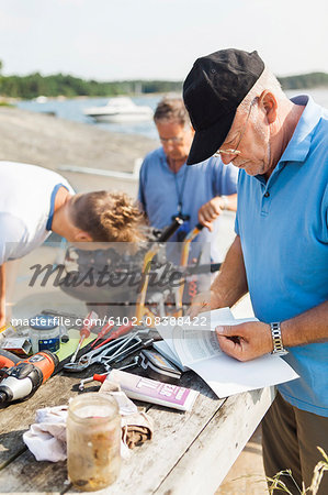 Men repairing boat