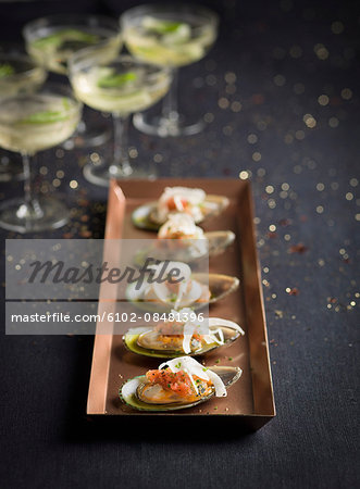 Mussels on tray and wine glasses