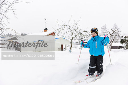 Young boy skiing in winter