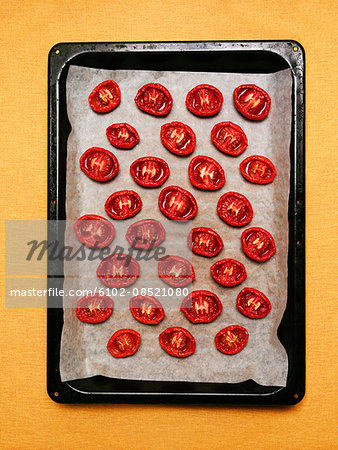 Baked tomatoes on baking tray