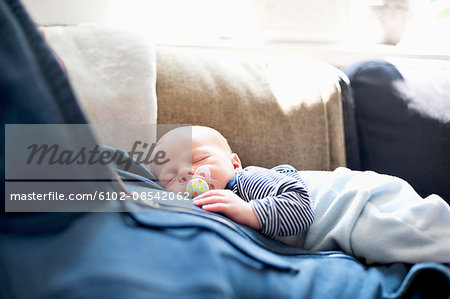 sleeping on sofa with baby