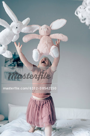 Laughing girl on bed