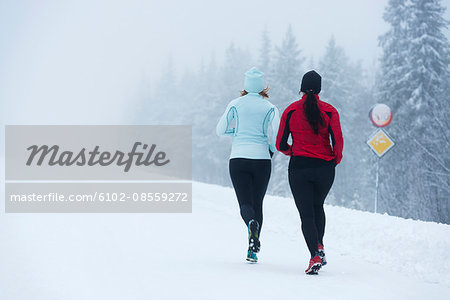 Two women running at winter, Sweden
