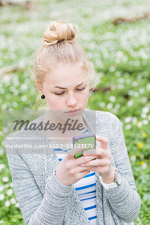 Young woman using phone