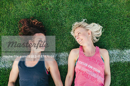 Female friends on grass pitch