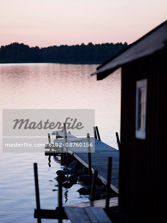 Wooden boathouse at dusk