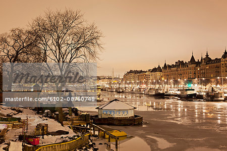 Illuminated moored boats at Djurgardsbron, Stockholm, Sweden