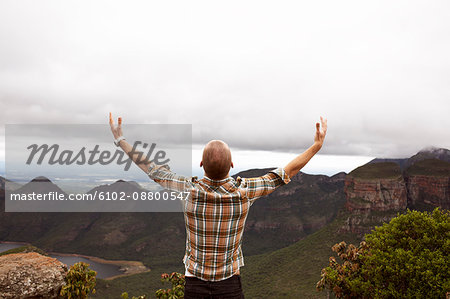 Man standing by a canyon, South Africa.